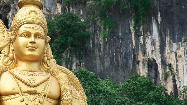 golden statue and Batu caves