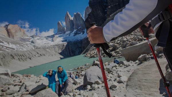 Two women sitting down in front of tourist in chilean Patagonia in El Chaltén